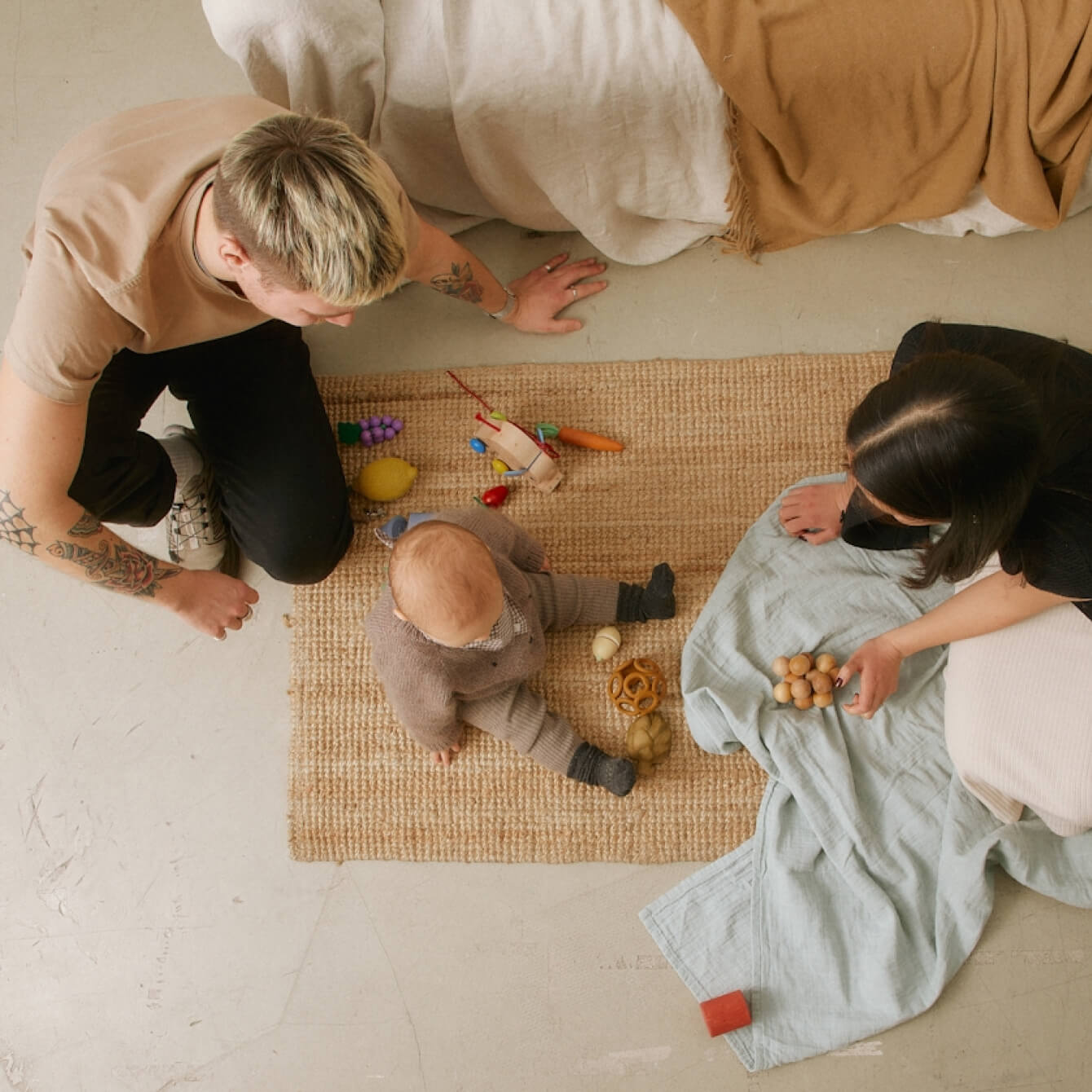 A group of children playing together with their parents