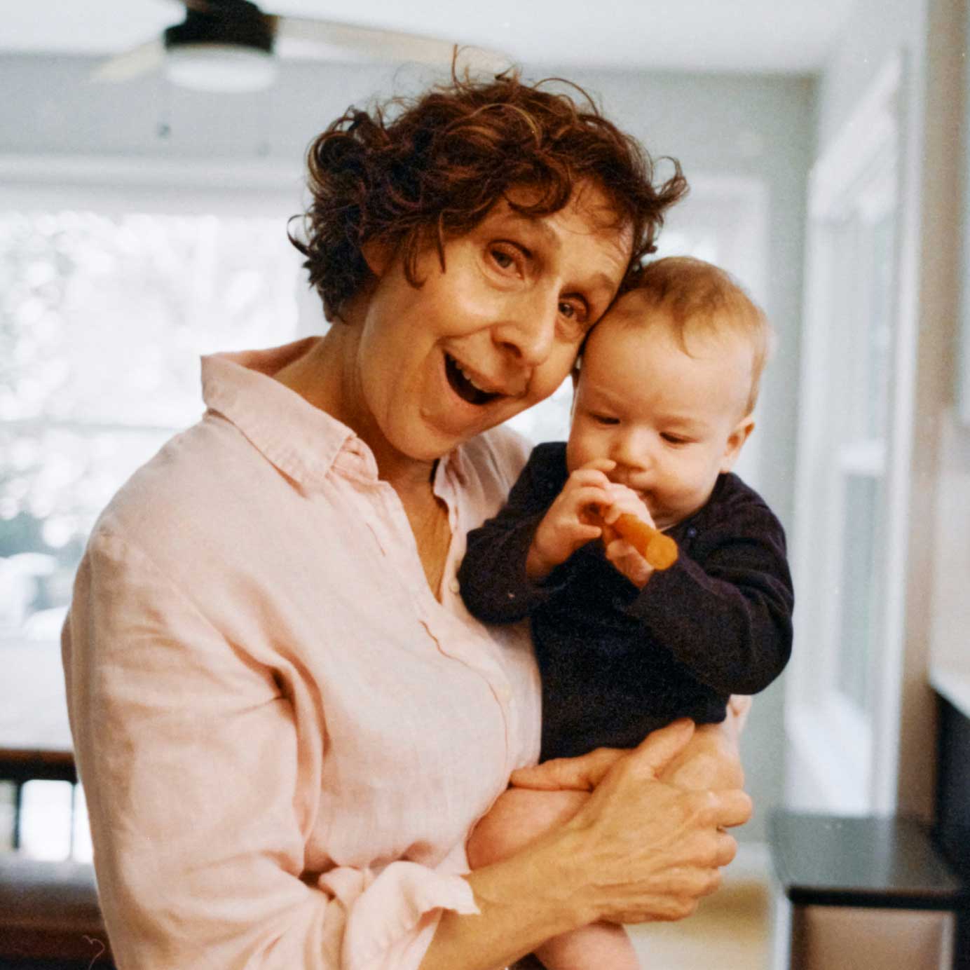 Grandmother holds an infant
